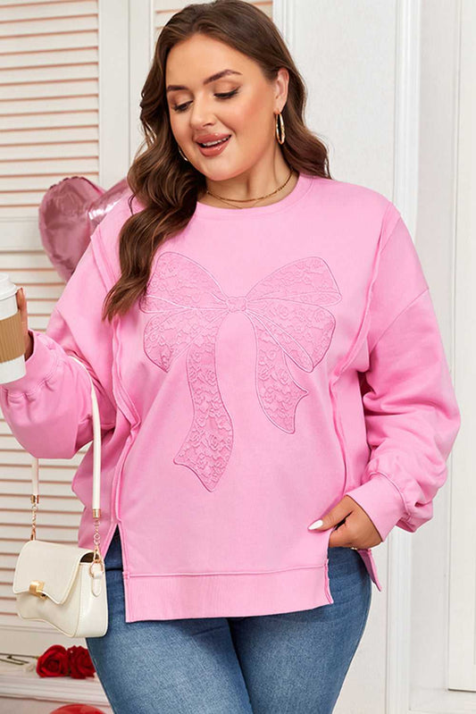 Pink Bow Plus Size Sweatshirt with lace detailing, styled with jeans for a casual daily look. Features side slits and medium-high elasticity.