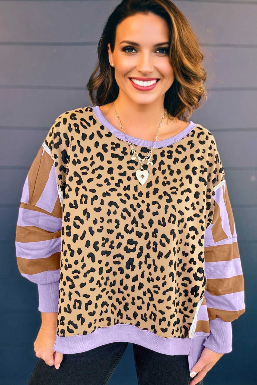 Front view of Curve Leopard Stripe Baggy Sweatshirt in lavender, featuring relaxed fit and color-blocked striped sleeves for trendy fall looks.