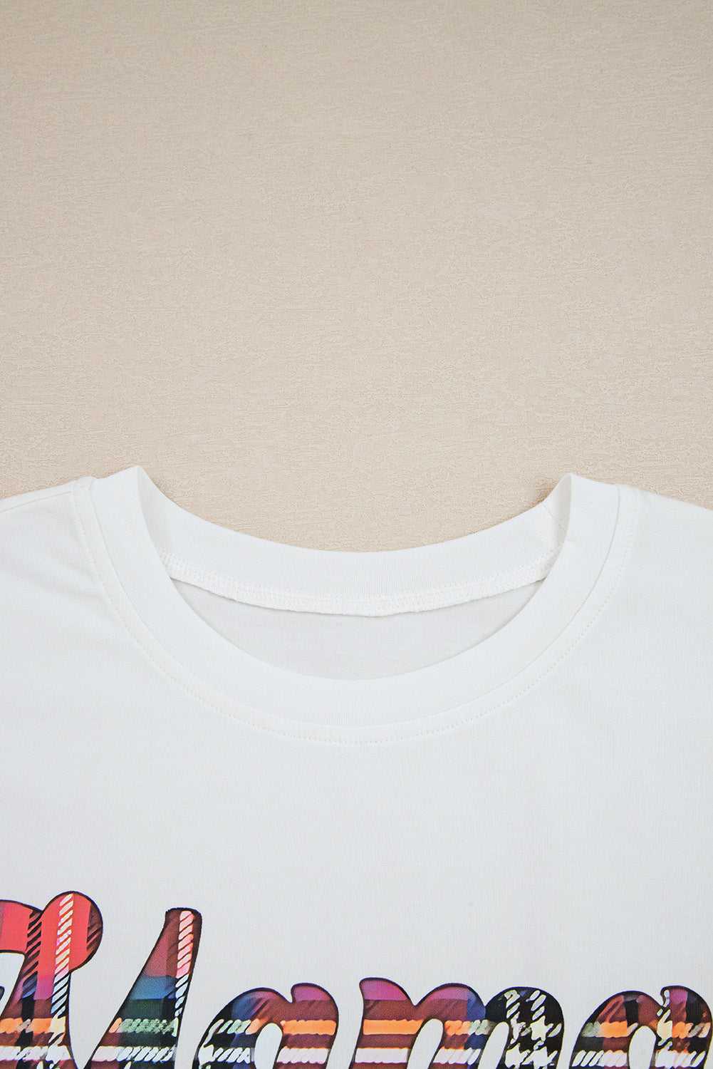 Close-up of the neckline on the 'Mama Claus' t-shirt from the Ladies Nutcracker Christmas Lounge Set by FashionFitz UK, showing soft cotton fabric.