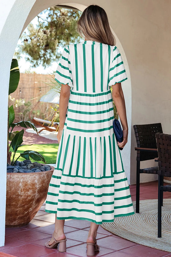 Green stripe empire waist midi dress showing ricrac trim at neckline and sleeve edges, side view, Fashionfitz