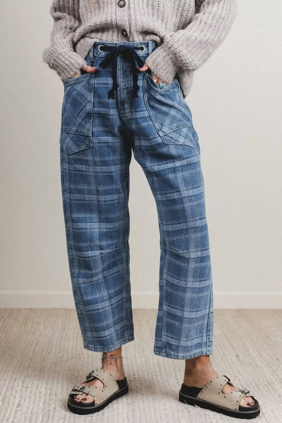 Grommet drawstring waist detail close-up on sky blue plaid denim jeans — Fashionfitz UK