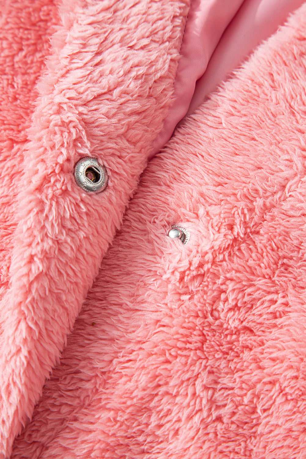 Texture shot of soft synthetic fleece in varsity pink tone