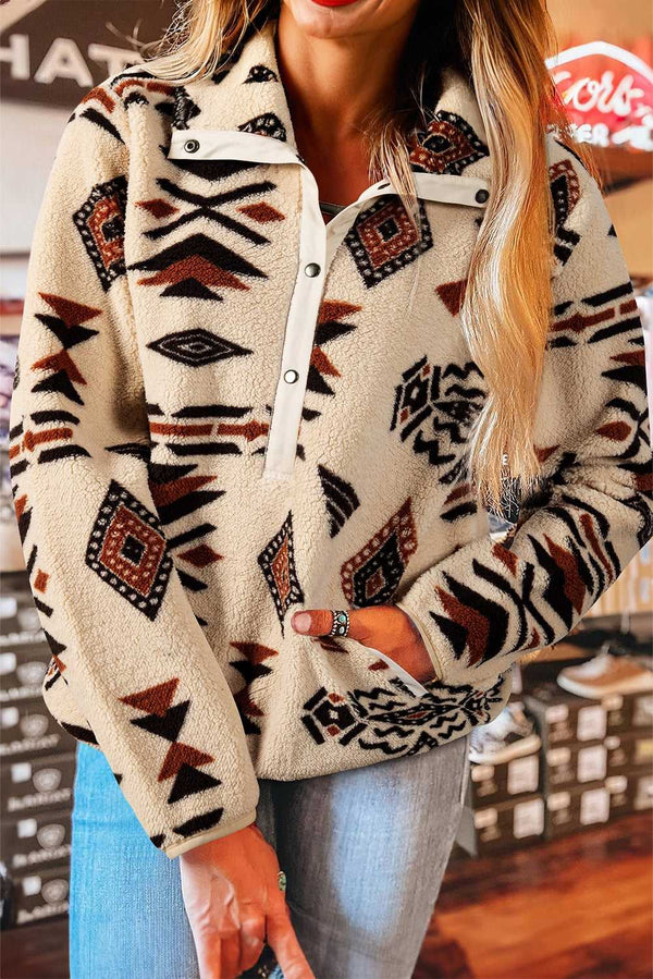 Model wearing beige Aztec fleece sweatshirt with half zip