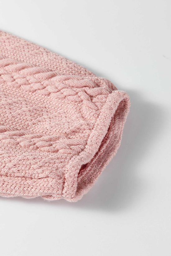 Detailed sleeve view of the Blush Pink Cable Knit Co‑Ord showing the soft, textured knit fabric and rolled cuff finish for added comfort.