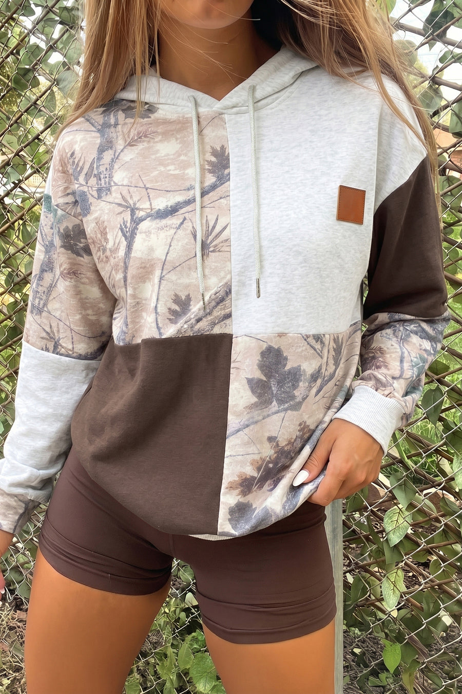 Camo drawstring hoodie styled with dark jeans and boots — Fashionfitz UK