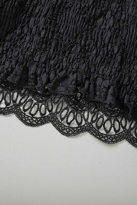 Detailed close-up of the hem on the Black Crochet Lace Bralette Crop Top highlighting the scalloped lace edge and textured fabric.
