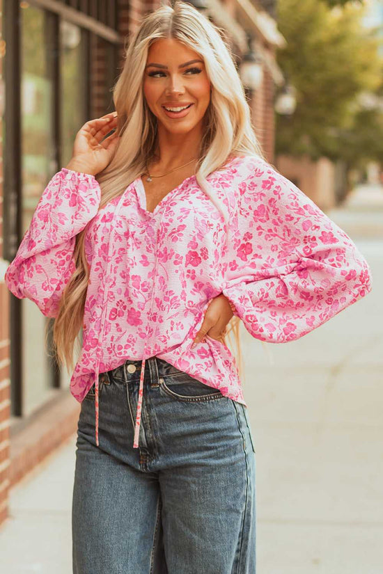 Model posing in Pink Floral Lightweight Blouse with hand on hip, ideal for chic spring fashion.