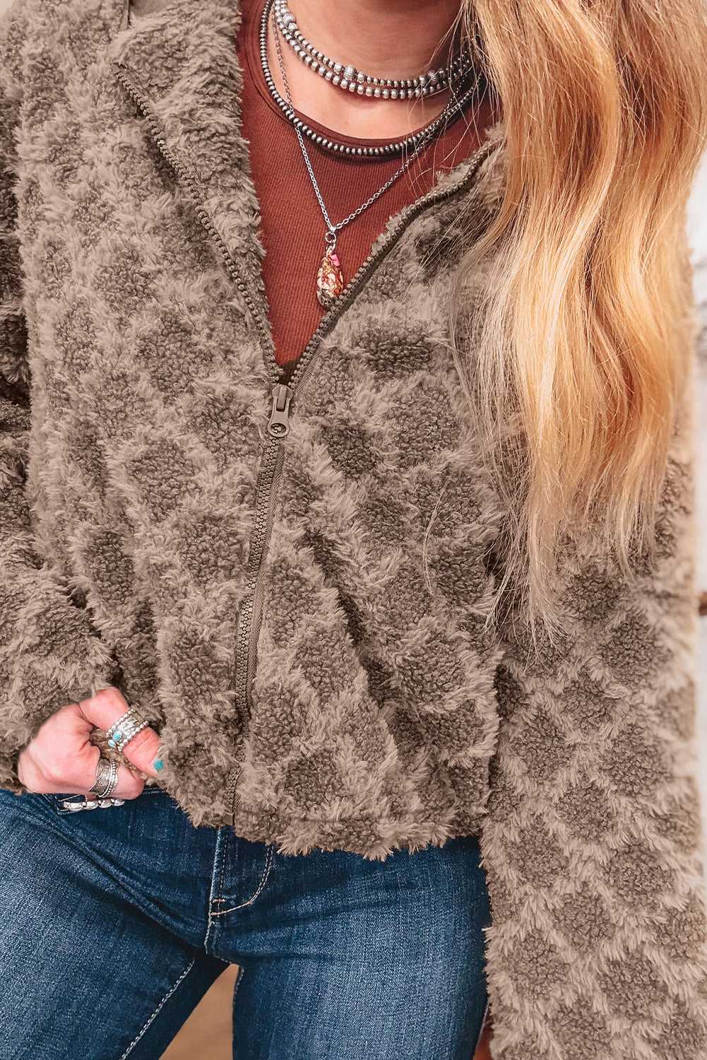 Close-up of Camel Sherpa Fleece Jacket highlighting soft textured fleece and full zip closure, perfect for daily cold-weather wear.