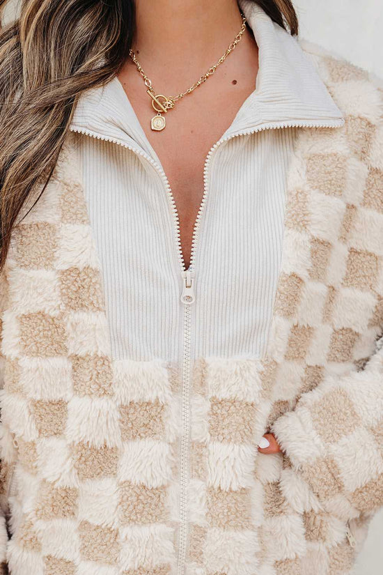 close-up of a Person wearing a Corduroy Sherpa Jacket with a neutral background