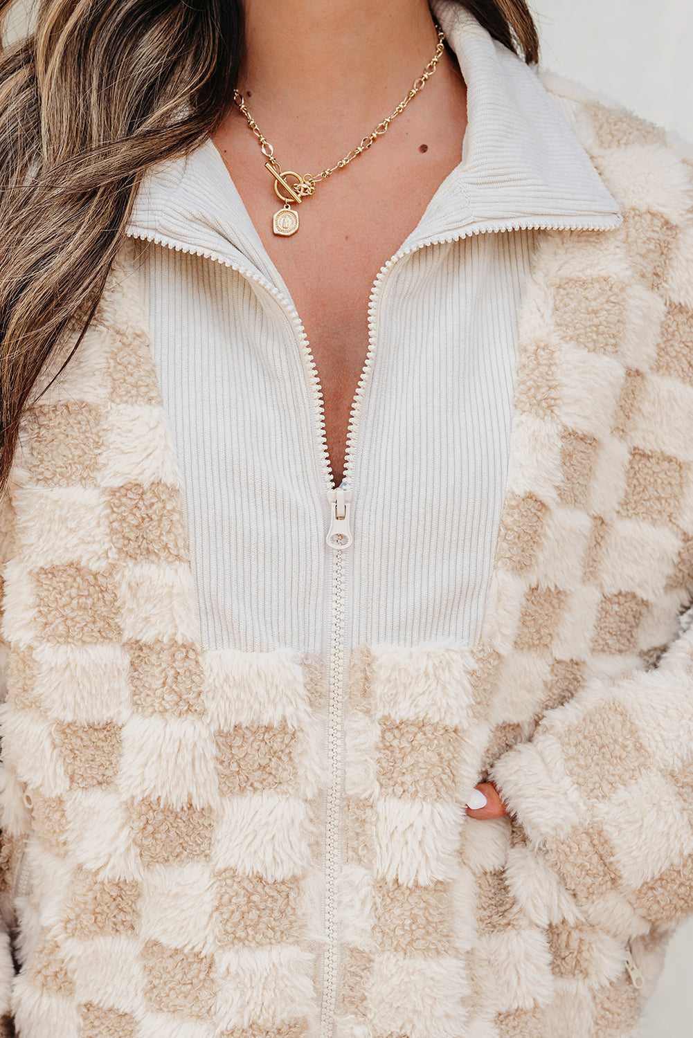 close-up of a Person wearing a Corduroy Sherpa Jacket with a neutral background