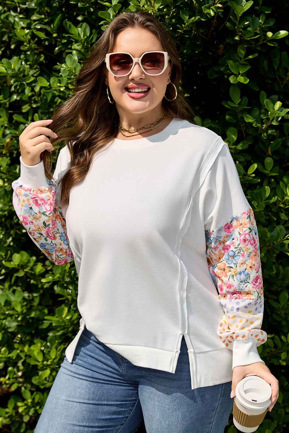 Floral sleeve sweatshirt in plus size featuring colorful patchwork sleeves and side slits. Perfect for chic, comfortable everyday outfits.