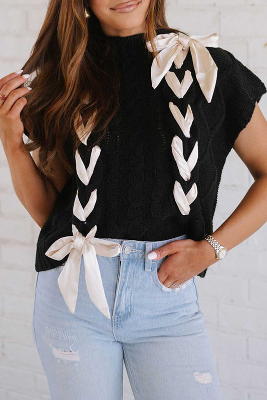 Satin Bowknot Sweater - Short Sleeve Style in black knit with cream satin bows, styled casually with ripped jeans for a chic fall look.