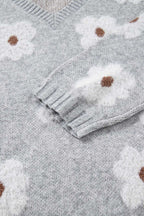 Sleeve and torso detail of FashionFitz Oversized Grey Floral Knit Jumper with ribbed cuff and soft floral knit design.