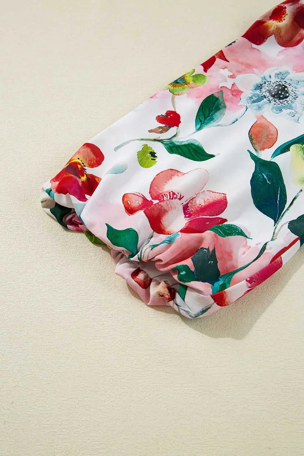 Sleeve detail of Floral Shift Dress - Casual Elegance showing elastic cuff and colorful floral pattern for a feminine finish.