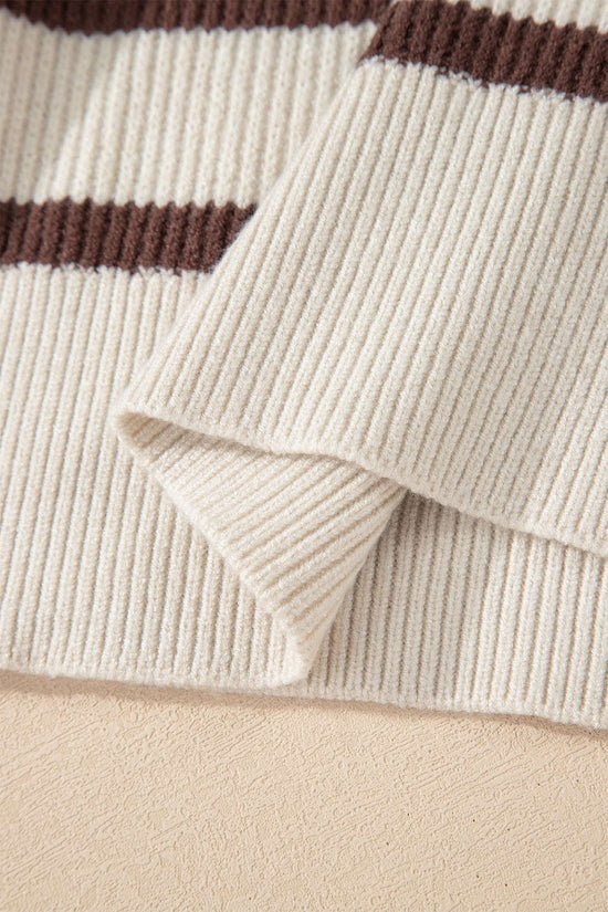 Close-up of ribbed hem on beige and brown striped Henley jumper. Soft knit texture ideal for cozy women’s fall sweaters.