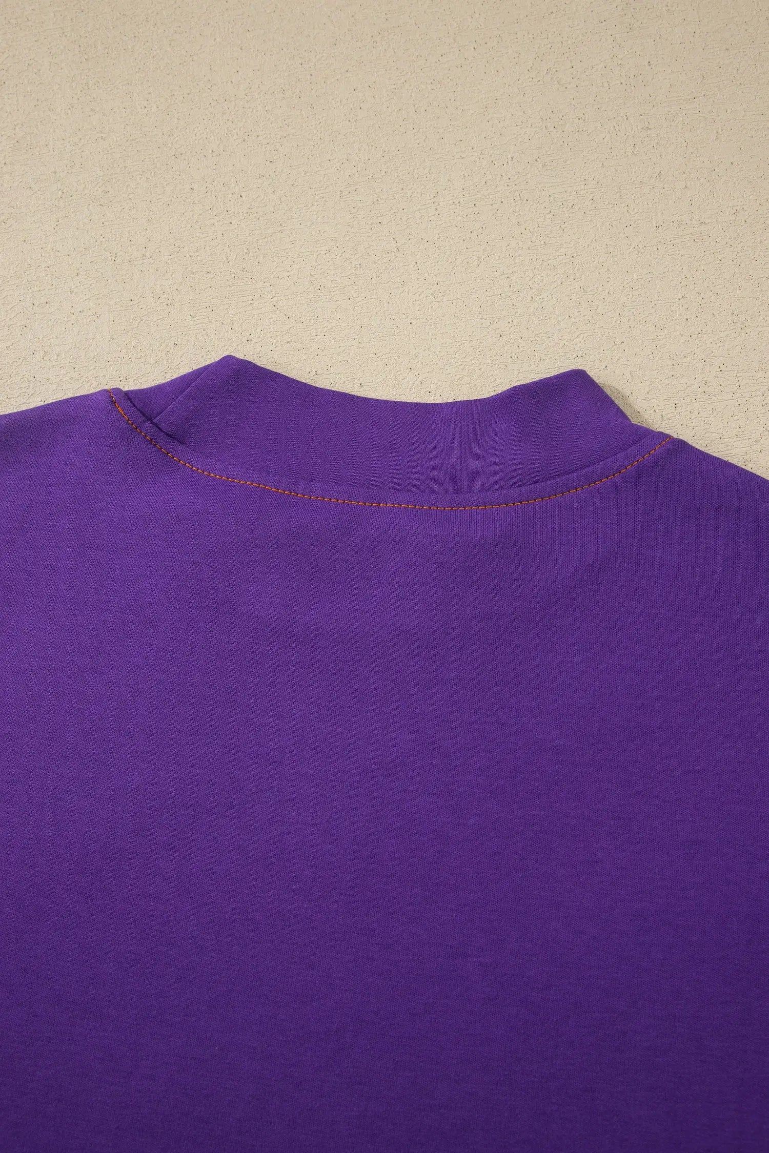 Women's reversible tee detail view contrast stitch