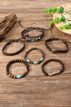 Set of leather and beaded bracelets on a wooden surface with measurements.