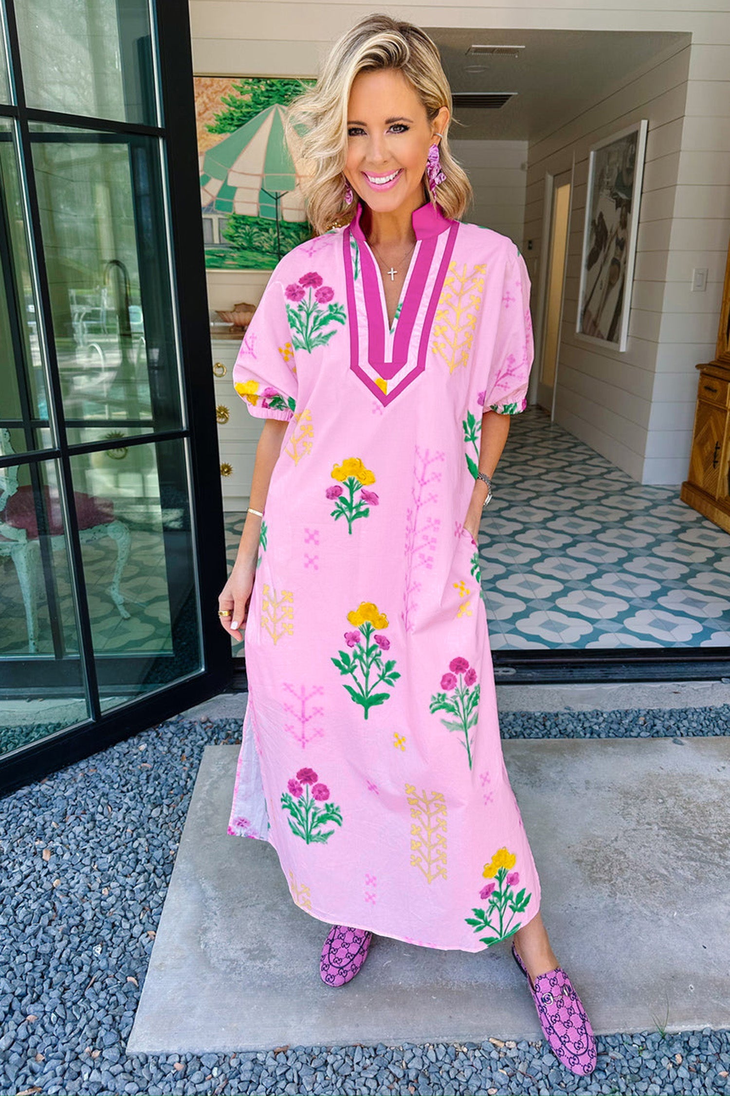 Women's pink floral midi dress lifestyle shot summer garden