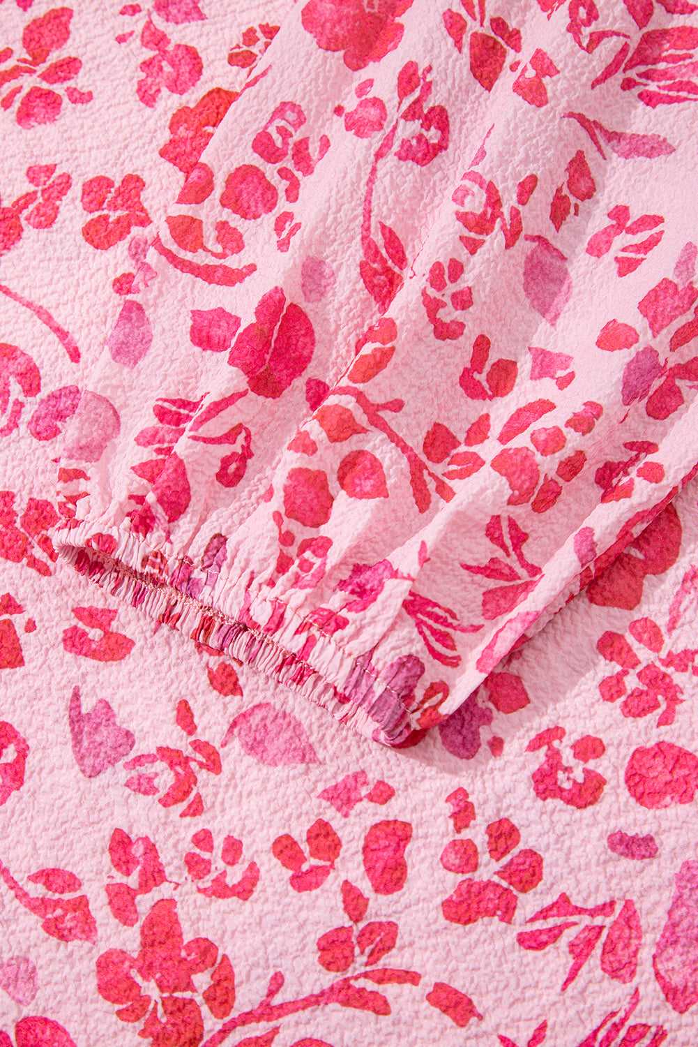 Elastic cuff detail on Pink Floral Lightweight Blouse sleeve, showcasing the delicate floral print and textured fabric.