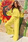 Joyful model in yellow Drop Crop Wide-Leg Pants Set dancing outdoors, ideal for showcasing vibrant and comfy fall fashion.