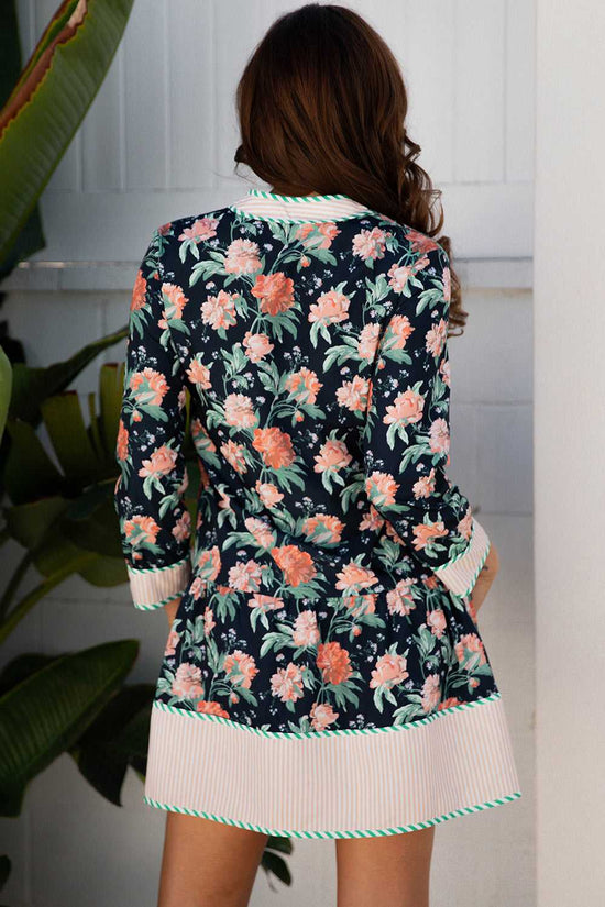 Back view of the Ladies Blue Floral Shift Mini Dress with striped hem and cuffs, showcasing all-over floral print and feminine Southern Belle style.