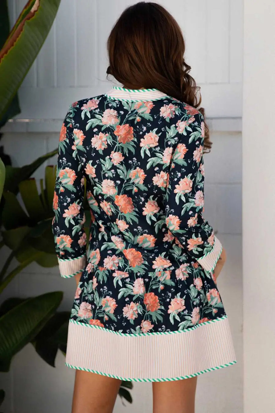 Back view of the Ladies Blue Floral Shift Mini Dress with striped hem and cuffs, showcasing all-over floral print and feminine Southern Belle style.
