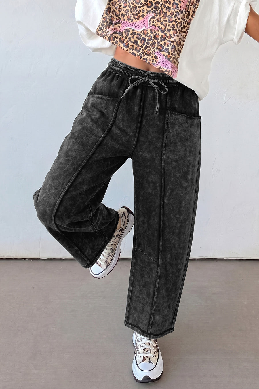 Black barrel leg drawstring trousers side view showing relaxed wide leg silhouette — Fashionfitz UK