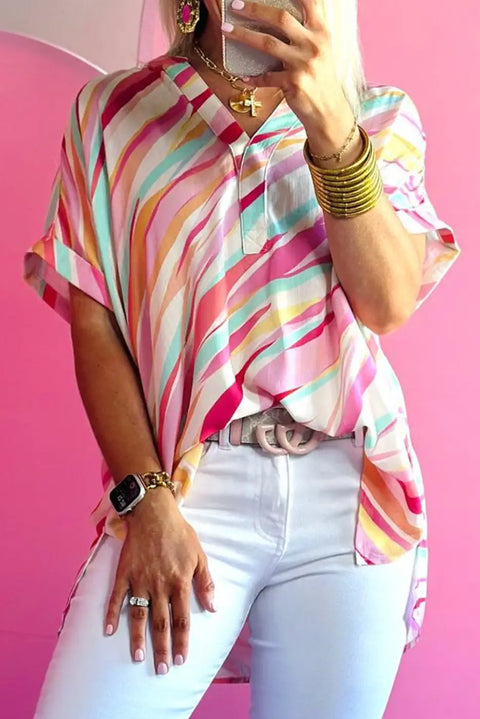 Multicolour abstract print high-low hem short sleeve V-neck blouse front view — Fashionfitz UK