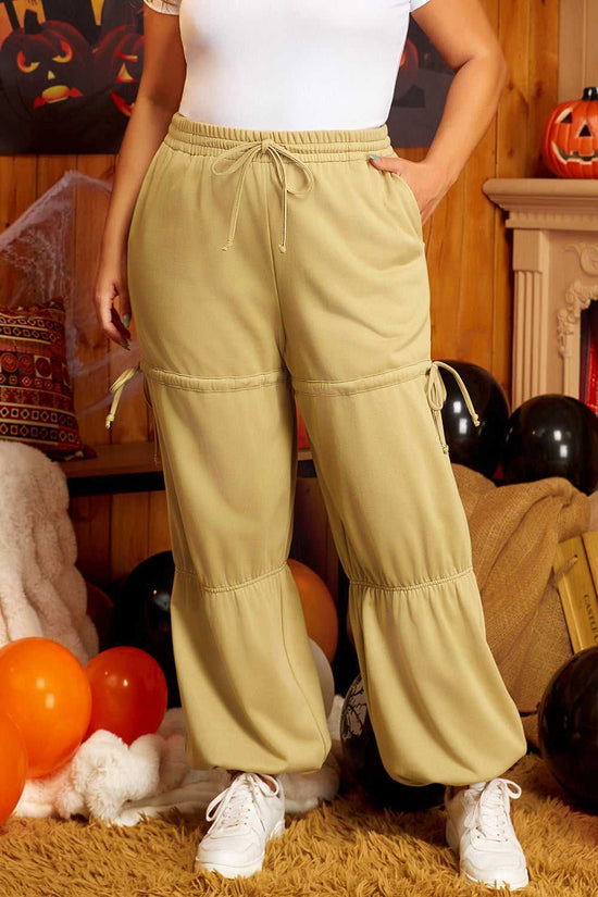 Full front view of plus size beige Terry Knit Sweatpants featuring drawstring waist and tiered leg design, styled for everyday wear.