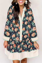 Front close-up of Ladies Blue Floral Shift Mini Dress with orange floral pattern and striped trim, blending feminine and Southern Belle aesthetics.