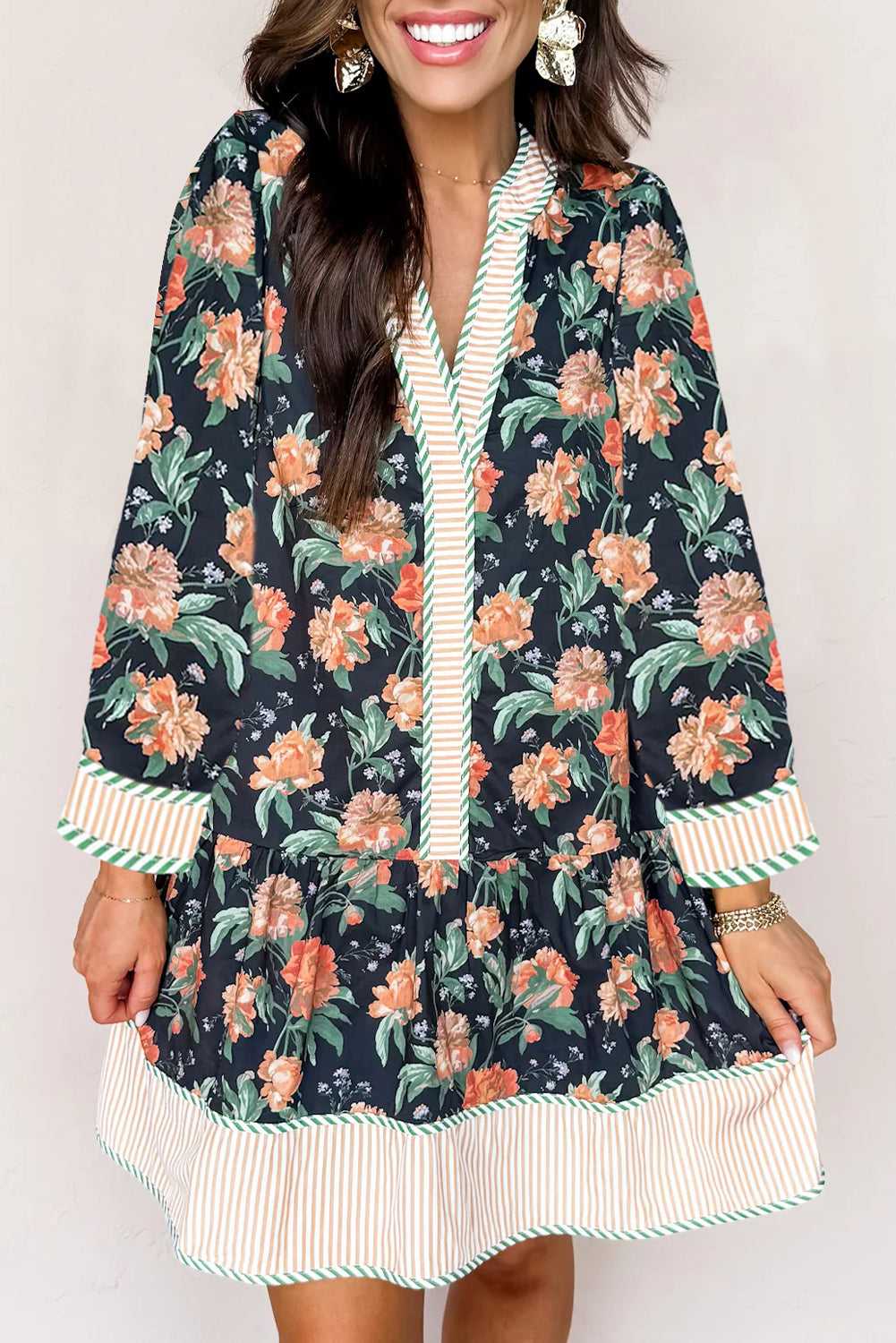 Front close-up of Ladies Blue Floral Shift Mini Dress with orange floral pattern and striped trim, blending feminine and Southern Belle aesthetics.