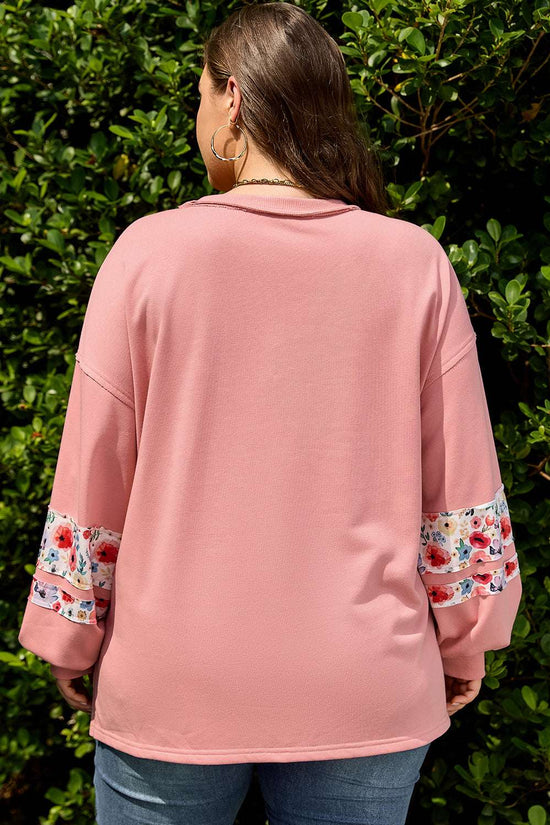 Back view of Curve Blush Peach Floral Appliqué Sweatshirt for Women showing relaxed fit and floral sleeve detail, ideal for plus size casual wear.