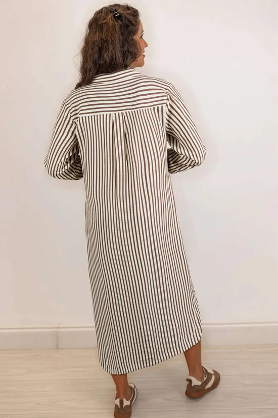 Back view of brown striped midi shirt dress showing H-line silhouette and lightweight fabric, perfect for spring outfits.