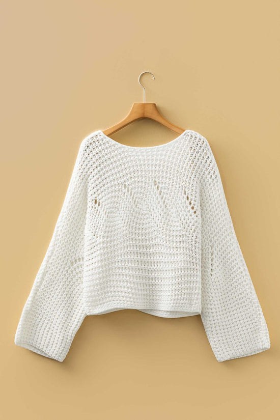 White wide sleeve hollow knit jumper displayed on hanger, showing its lightweight open-knit design and loose silhouette.