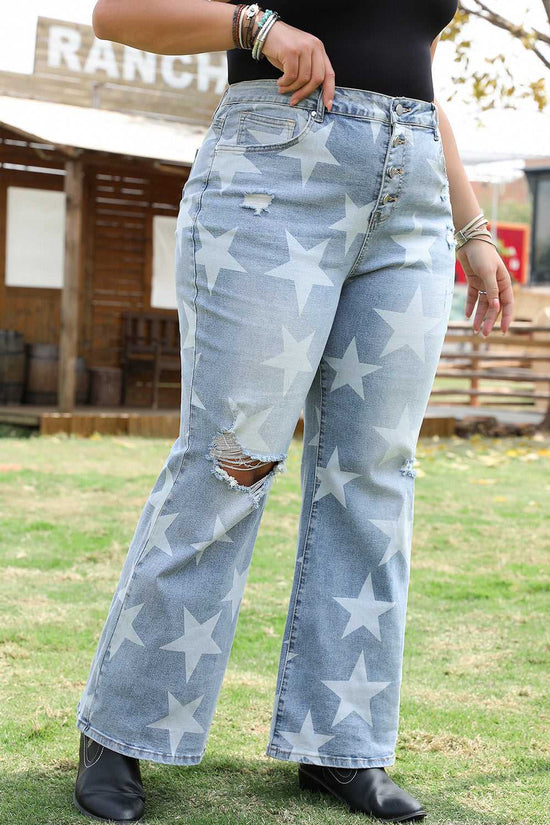 Side angle of blue star printed plus size jeans with distressed accents and flared legs, styled for a trendy western outfit.