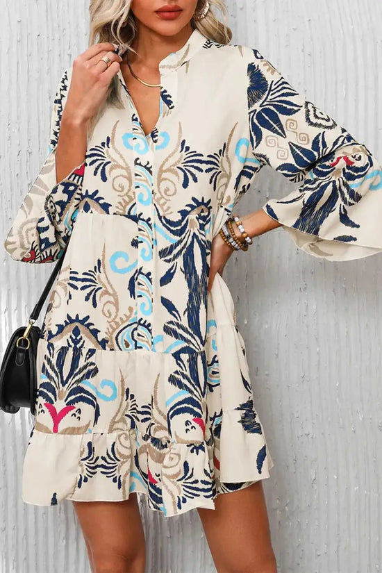 Front close-up of the Tribal Mini Dress worn by model, showcasing the buttoned neckline and bold boho patterns.