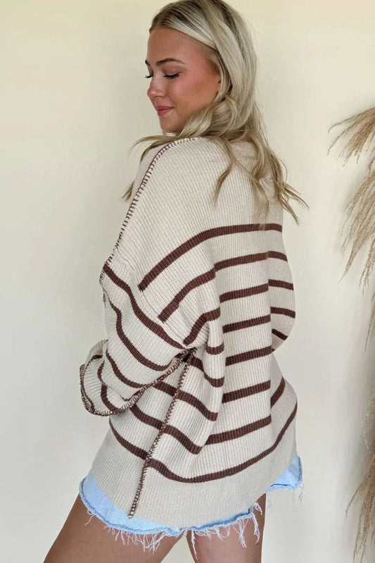 Back view of casual slouchy striped Henley jumper in cream and brown, showcasing relaxed fit and drop shoulders.