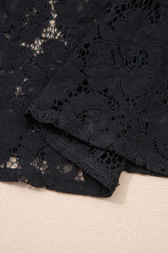Detailed view of the floral lace fabric on the Black Lace Overlay Maxi Sundress, showcasing its delicate texture and craftsmanship.