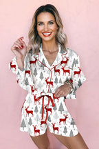 White Christmas Print Velvet Trim Pyjamas for women with festive red reindeer and tree pattern, soft velvet accents and button-up top.