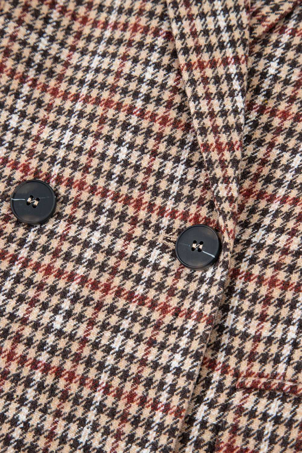 Detail of black buttons on Ladies Brown Houndstooth Fitted Blazer, showcasing double-breasted closure and classic design.