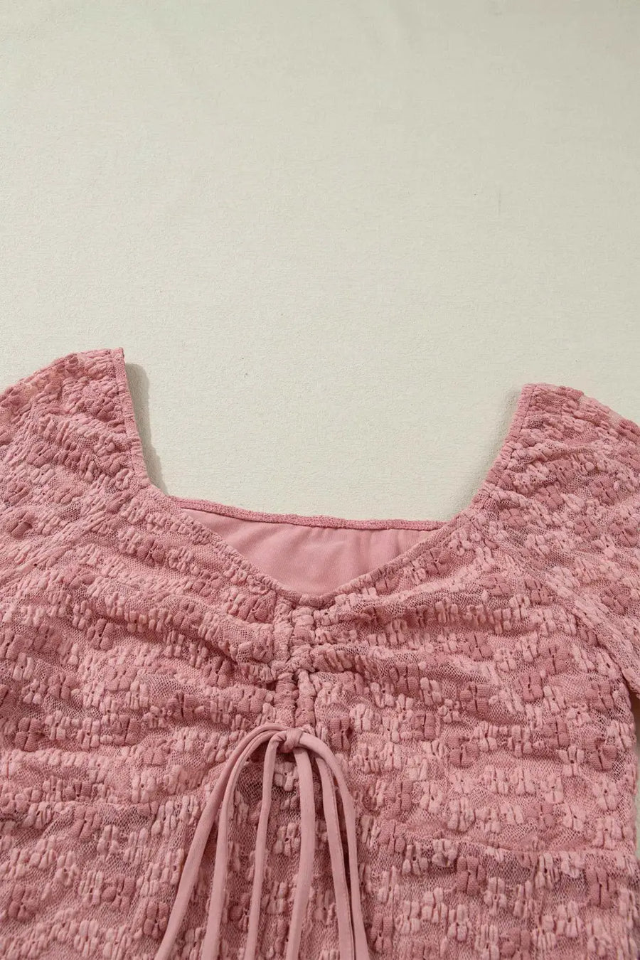 Side view of Pink Floral Lace Bell Sleeve Blouse showing flowing bell sleeve drape and square neckline — Fashionfitz