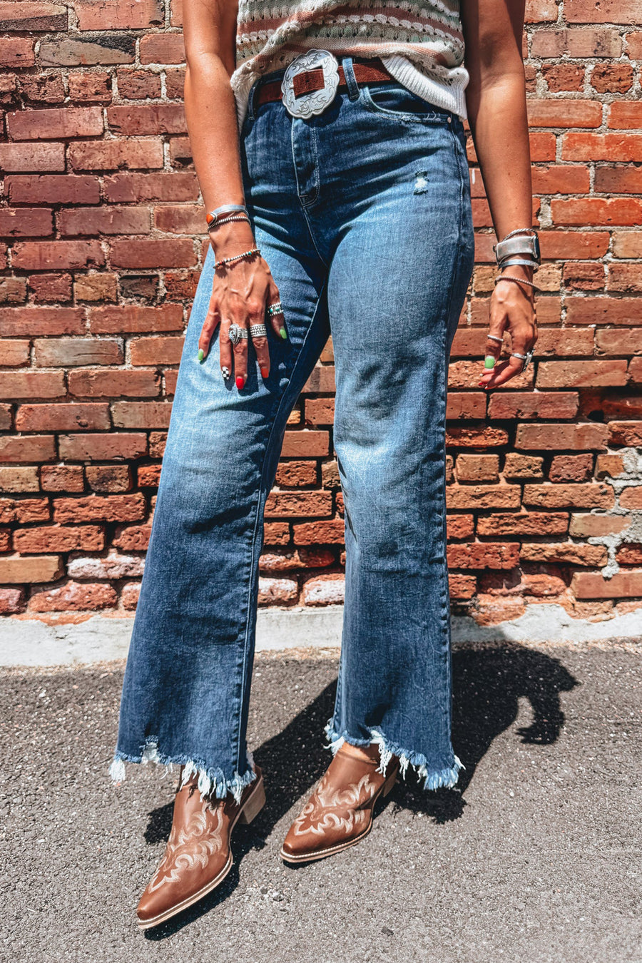 Denim texture detail shot on high waist frayed hem flare jeans — Fashionfitz UK