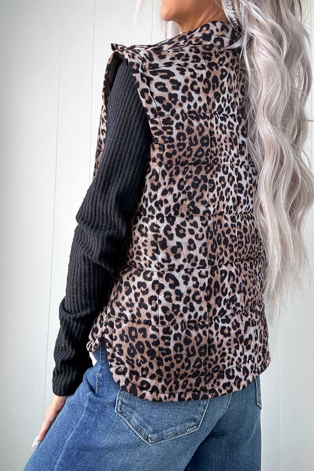 Back view of Leopard Print Quilted Puffer Gilet showing padded texture and curved hem. Stylish outerwear for autumn outfits.