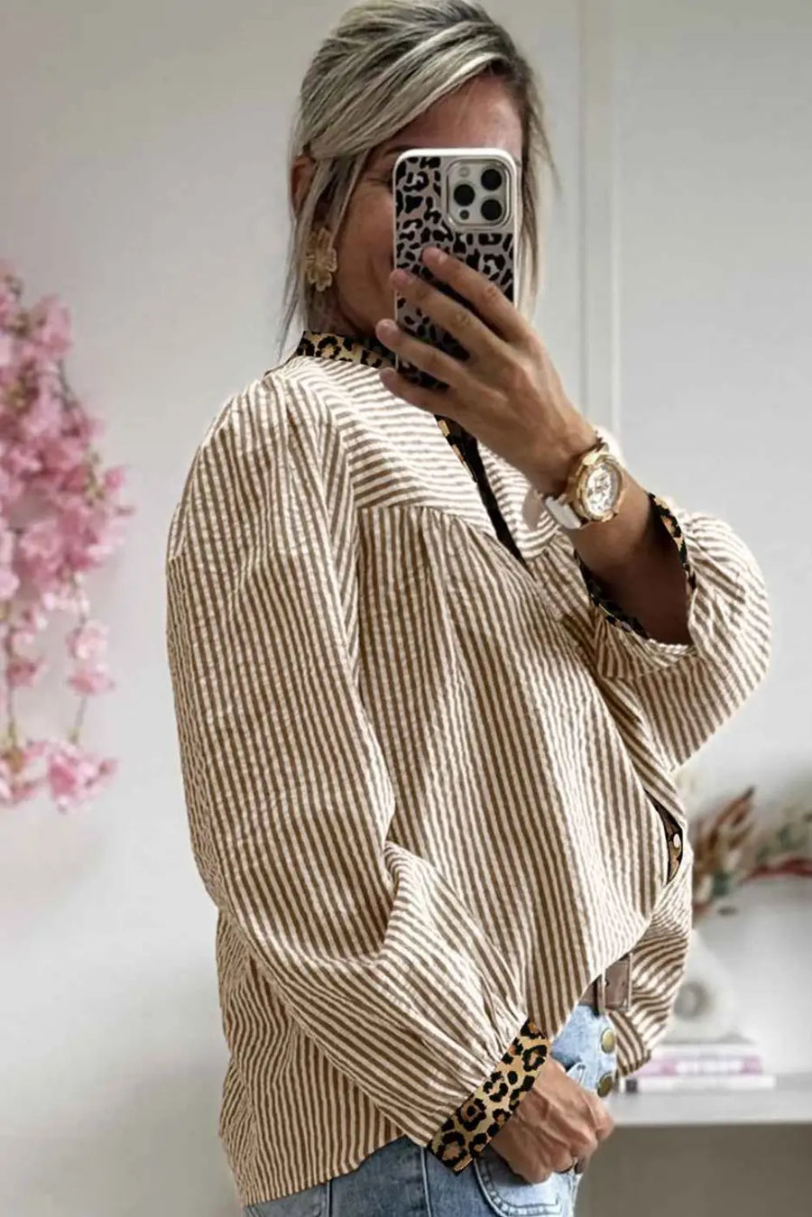 Side view of beige Leopard Pinstripe Contrast Shirt with leopard trim and relaxed fit, combining comfort with trendy patchwork design.