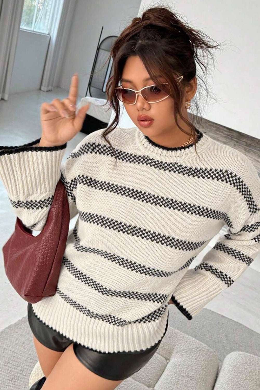 Model wearing Women's Apricot Striped Bell Sleeve Jumper with sunglasses and handbag, emphasizing casual southern belle style. Great for daily wear.