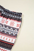 Elastic waistband detail of Women's Christmas Comfort Lounge Set in Black by FashionFitz, showing comfort fit and holiday pattern.
