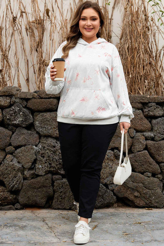 Model wearing Curve Floral Print Hoodie paired with black pants and white sneakers, showcasing a casual fall outfit for plus size women.