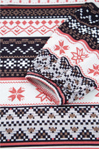 Fabric close-up of Women's Christmas Comfort Lounge Set in Black by FashionFitz, displaying soft texture and intricate holiday pattern.