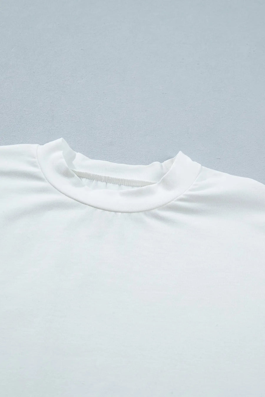 Women's lace patchwork top close-up detail hem trim