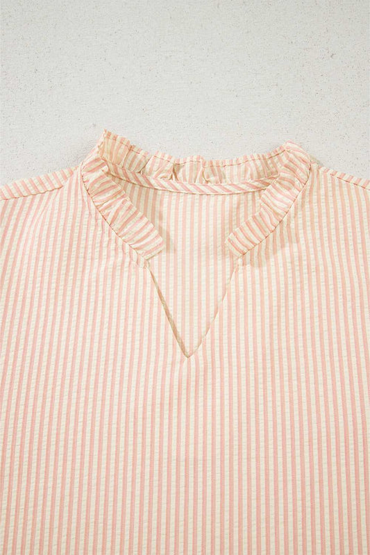 Close-up of the ruffled V-neckline on the Bow Cuff Pearl Embellished Blouse, showcasing elegant striped fabric detail.